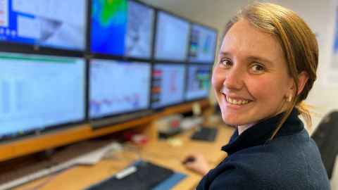 Dr Sally Watson in RV Tangaroa’s multibeam room where they monitor the information coming in through the echosounders to produce maps of the seafloor. Photo: Pascale Otis, NIWA