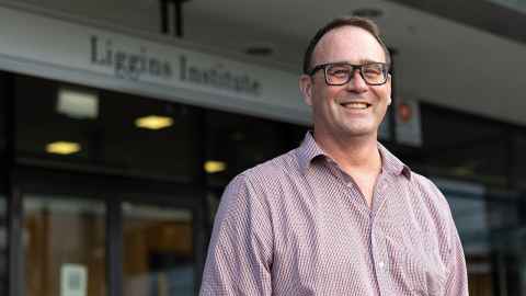 Justin O'Sullivan standing outside the Liggins Institute.