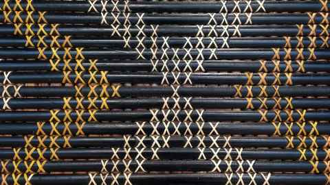 Māori weaving in black, white and yellow.