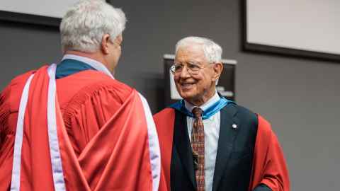 Professor Sir Richard Faull greets Professor Chris Shaw at Chris’s inaugural lecture.