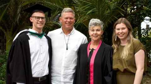 Four smiling people.