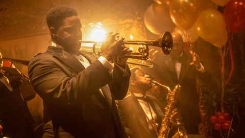 A man playing a trumpet.
