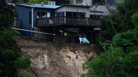 A house hanging over a hillside.