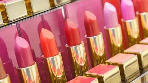 Image of a row of brightly coloured lipsticks 