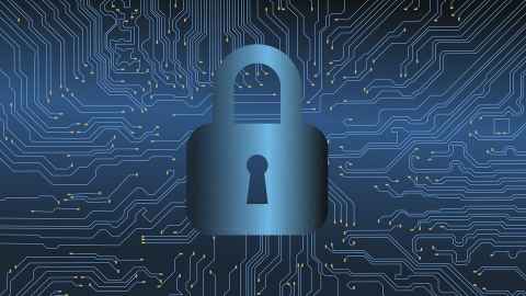 A stylised image of a padlock in front of a motherboard.