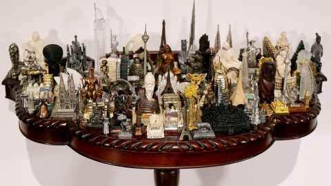 Models of buildings and statuettes.