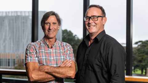 Professor Wayne Cutfield and Professor Justin O'Sullivan smiling in front of a window.