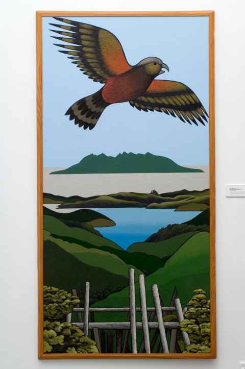 A painting of a kākā flying over green hills and blue water.