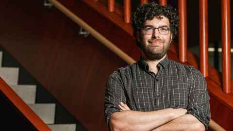 head and shoulders of Sam Mehr. He has a beard and glasses.