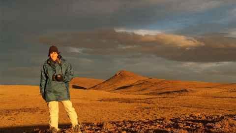 Professor Kathy Campbell in a deserted landscape.