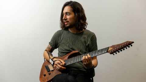 Dr Fabio Morreale with a guitar.