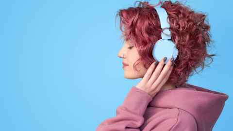 A young woman wearing headphones.