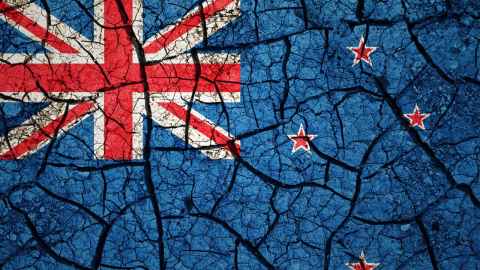 Concept image of NZ flag on cracked earth 