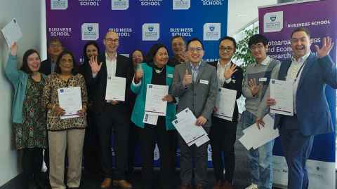 Winners and judges celebrate at the University of Auckland Business School. Photo by Jane Buriakova