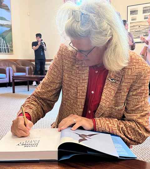 Greg O'Brien signing his book Don Binney: Flight Path (AUP) at the launch at OGH.