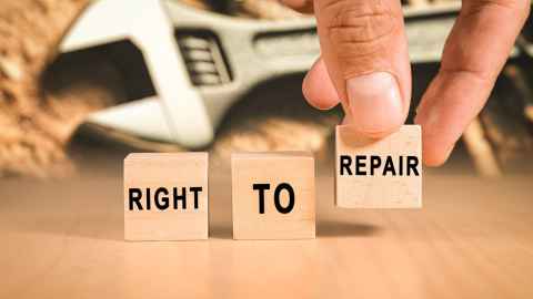 Blocks showing the words ' right to repair' with a spanner in the background.