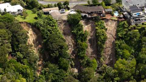 The Auckland Anniversary weekend floods resulted in many landslides like this one at Massey in Auckland. Photo: Brett Phibbs/ New Zealand Herald