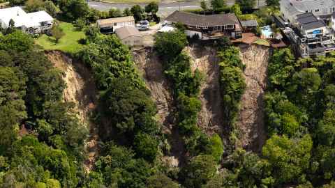 The Auckland Anniversary weekend floods resulted in many landslides like this one at Massey in Auckland. Photo: Brett Phibbs/ New Zealand Herald