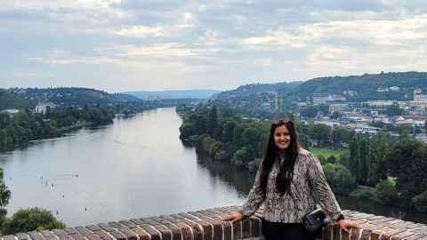  When she can, Yukti Vyas likes to explore Europe. Here she is in Vyšehrad,Prague, with the Vltava River behind her.