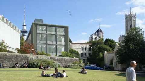 The ClockTower, Alfred Nathan House, Library with students sitting on grass