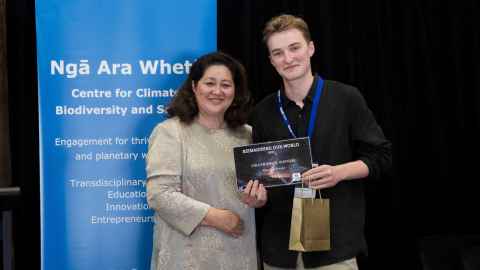 The Governor-General presents design and environmental science student Marco de Krester with his award.