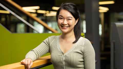 Associate Professor Amy Chan in an atrium space.
