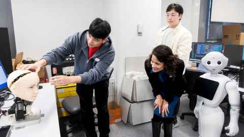 Vandi Verma exploring the robotics work in the CARES lab.