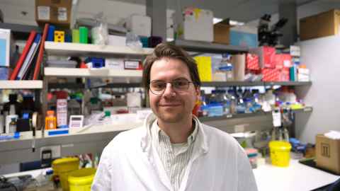 Dr Pauza in a lab