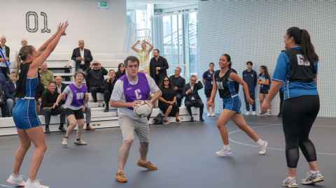 Chris Bishop on the hunt for someone to pass to. Adrienne Cleland in behind. 