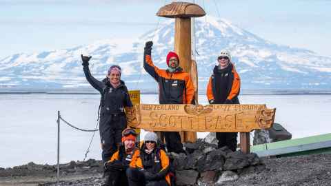 At Scott Base, from left, guide Bia Boucinhas, Katie Gilchrist on the ground next to Australian researcher Sandra Rodrigues, James Muirhead and Zoe Armstrong.