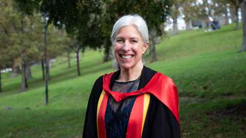 Esther in her PhD regalia in the Domain, Auckland