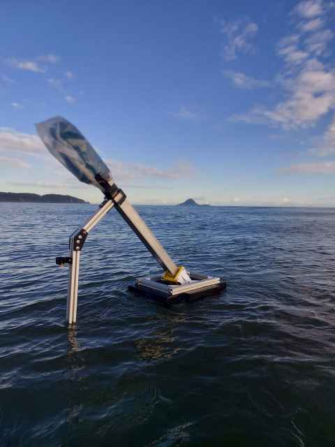 The wave energy converter harnesses ocean waves to generate electricity, even in calm conditions.