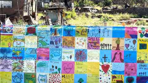 A wall of artwork done during a CAST workshop with children affected by the fires on Maui, Hawaii in 2023.