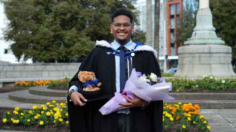 Image of Saula Lasaganibau in his graduation gear