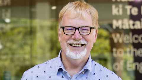 Professor Charles Clifton smiling outside the Faculty of Engineering and Design.
