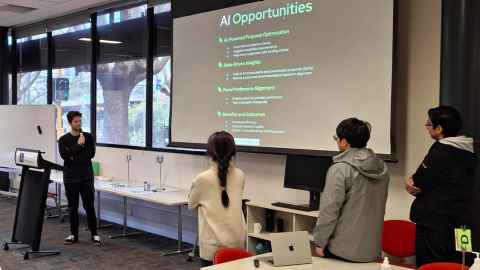 Master of AI student Thomas Clunie presents his team's work