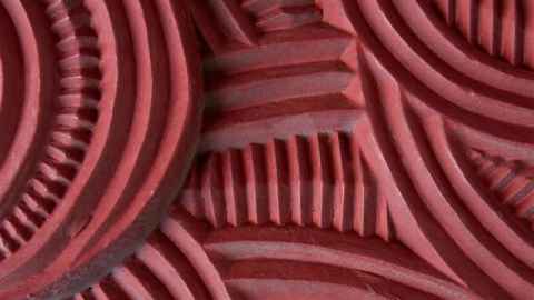 A close up image of Māori wood carving.