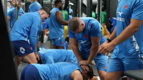 French in the weights area of the main gym pushing hard.