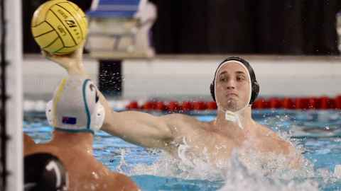 Water polo player in swimming pool
