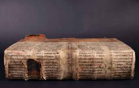 Spine covering made from a circa late 12th century manuscript fragment.