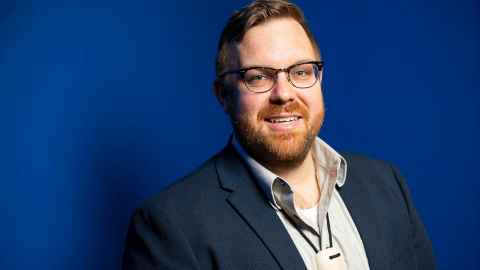 Tim with blue background