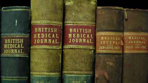 Antique British Medical Journals on bookshelf 