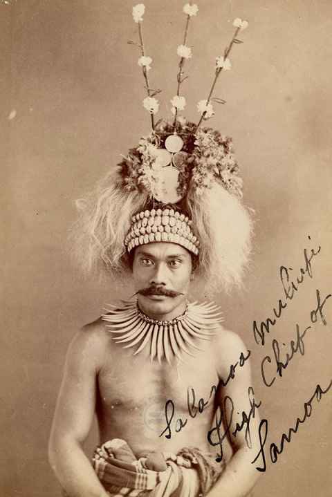 Black and white photograph of "Salanoa Muliufi, High Chief of Samoa" wearing tuiga; the large shells in the headbands are nautilus shells; pearl and whale bone necklace and waist wrap. Samoa. © The Trustees of the British Museum. Shared under a Creative Commons Attribution-NonCommercial-ShareAlike 4.0 International (CC BY-NC-SA 4.0) licence