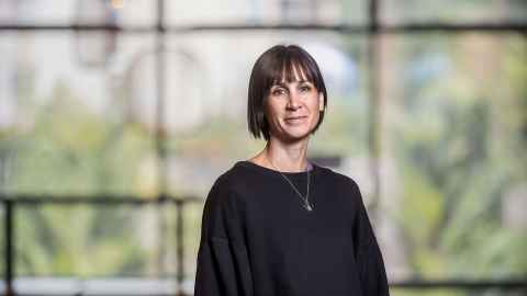 Professor Sam Marsh in front of a window.