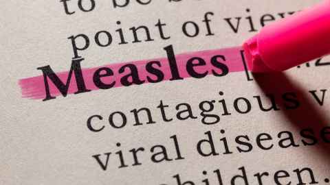 Fake dictionary, with definition of Measles highlighted in pink
