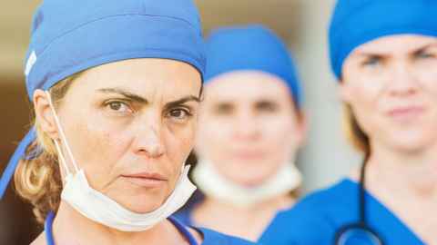 Three tired looking nurses