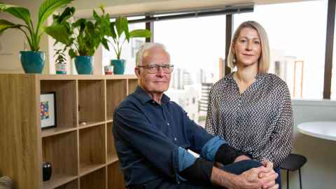 Peter and Merryn in an office with plants