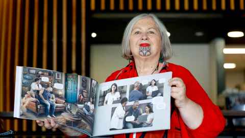 Tess Moeke-Maxwell holding one of the new books launched.