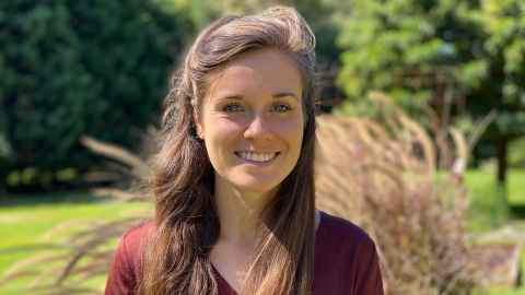 Dr Berit Follong head and shoulders in a park.