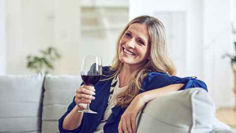 Woman relaxing with a glass of wine.